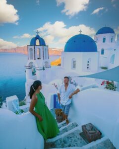 Santorini Greece, young couple on luxury vacation at the Island of Santorini